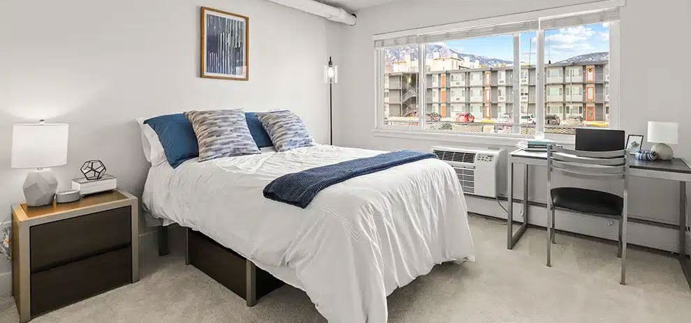Furnished bedroom with mountain views