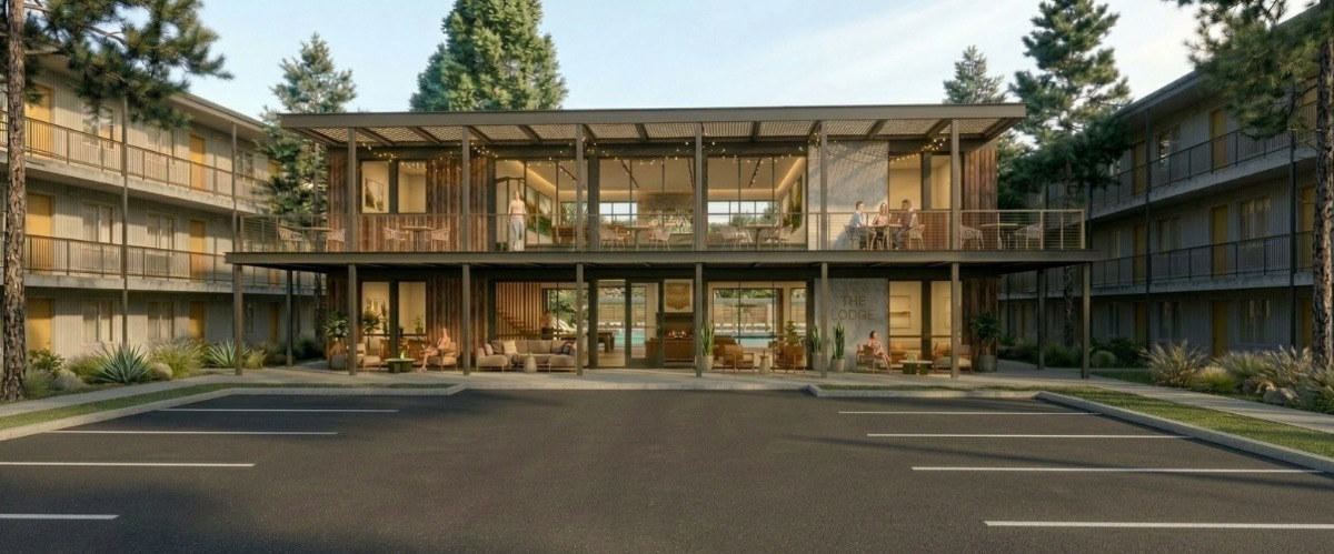 Clubhouse and amenity barn at dusk — rendering