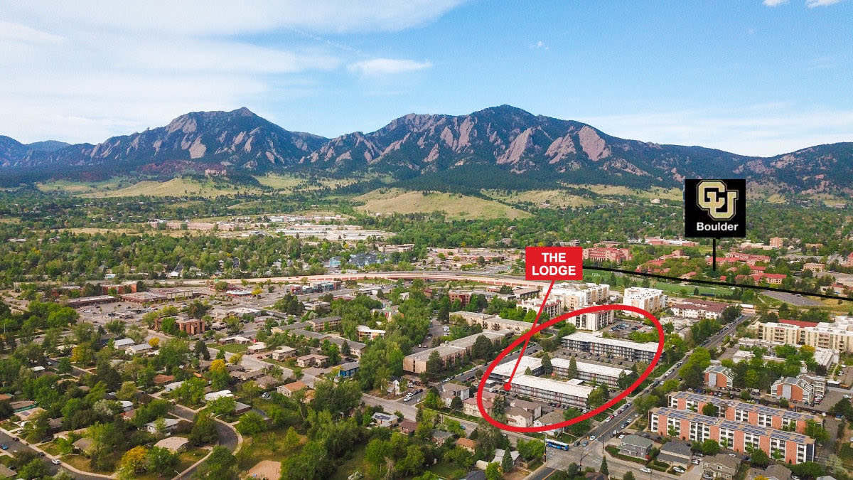 Aerial — The Lodge and CU Boulder beneath the Flatirons